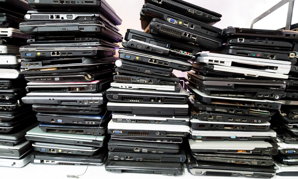 stack of old laptop computers