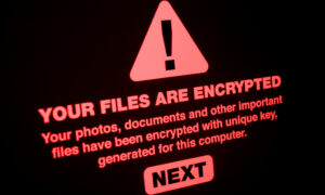 Image of ransomware attack with a warning sign and the words: "Your files are encrypted."