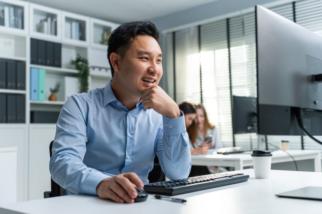 male employee on computer doing phishing prevention training