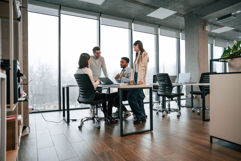 coworkers in meeting on computer using public cloud services