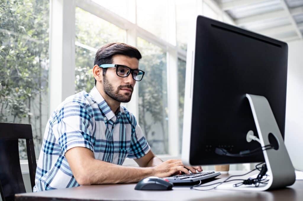 employee working on computer using encryption key to access data